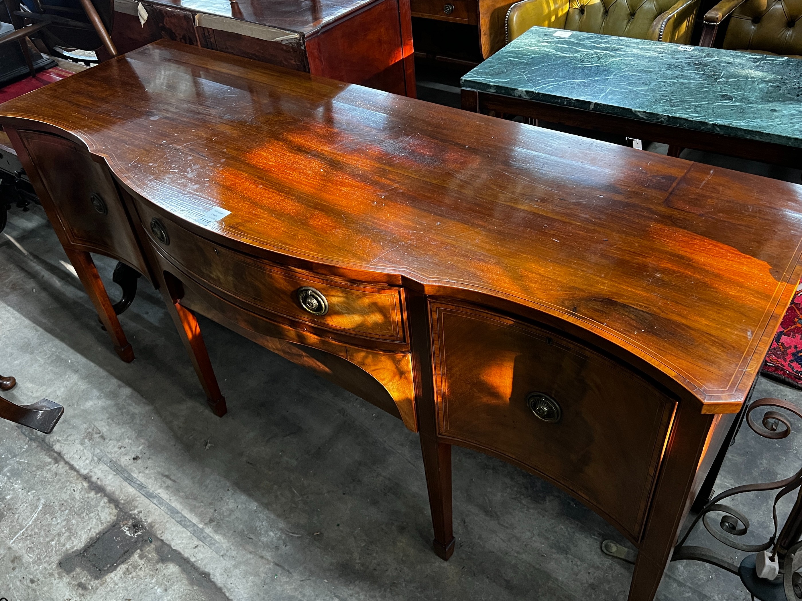 A George III style banded mahogany serpentine fronted sideboard, length 183cm, depth 64cm, height 92cm